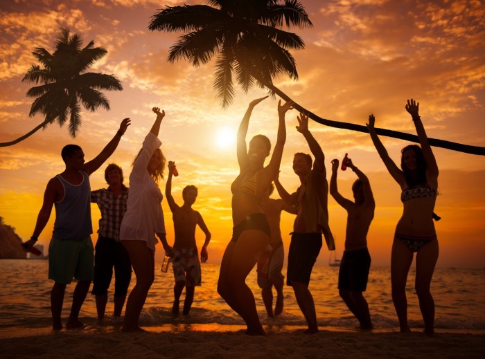Group of Cheerful People Partying on a Beach